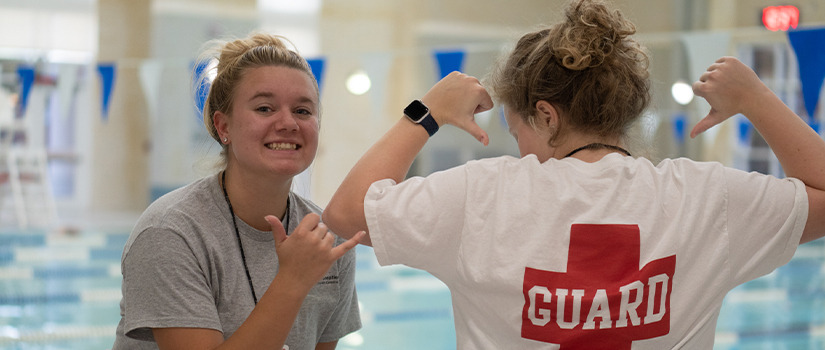 Lifeguards posing for a fun photo on shift.