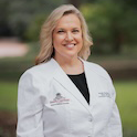headshot of woman in medical lab coat