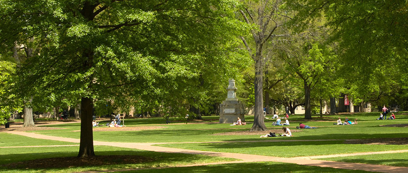 The Maxcy Monument rises from the center of the historic horseshoe surrounded by old trees